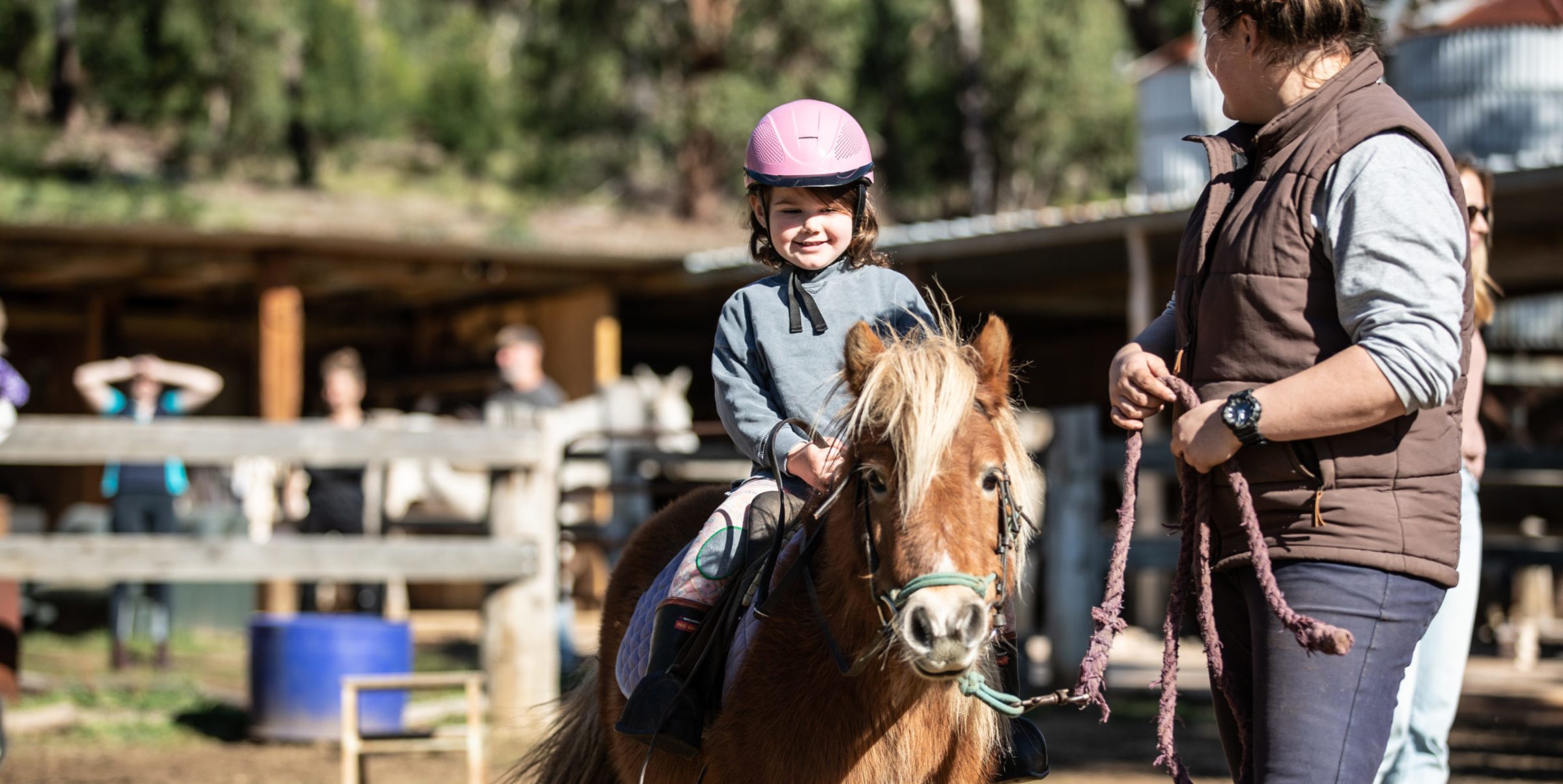 Spring-Creek-Horse-Rides-05-scaled-e1623299379633 a person riding a horse